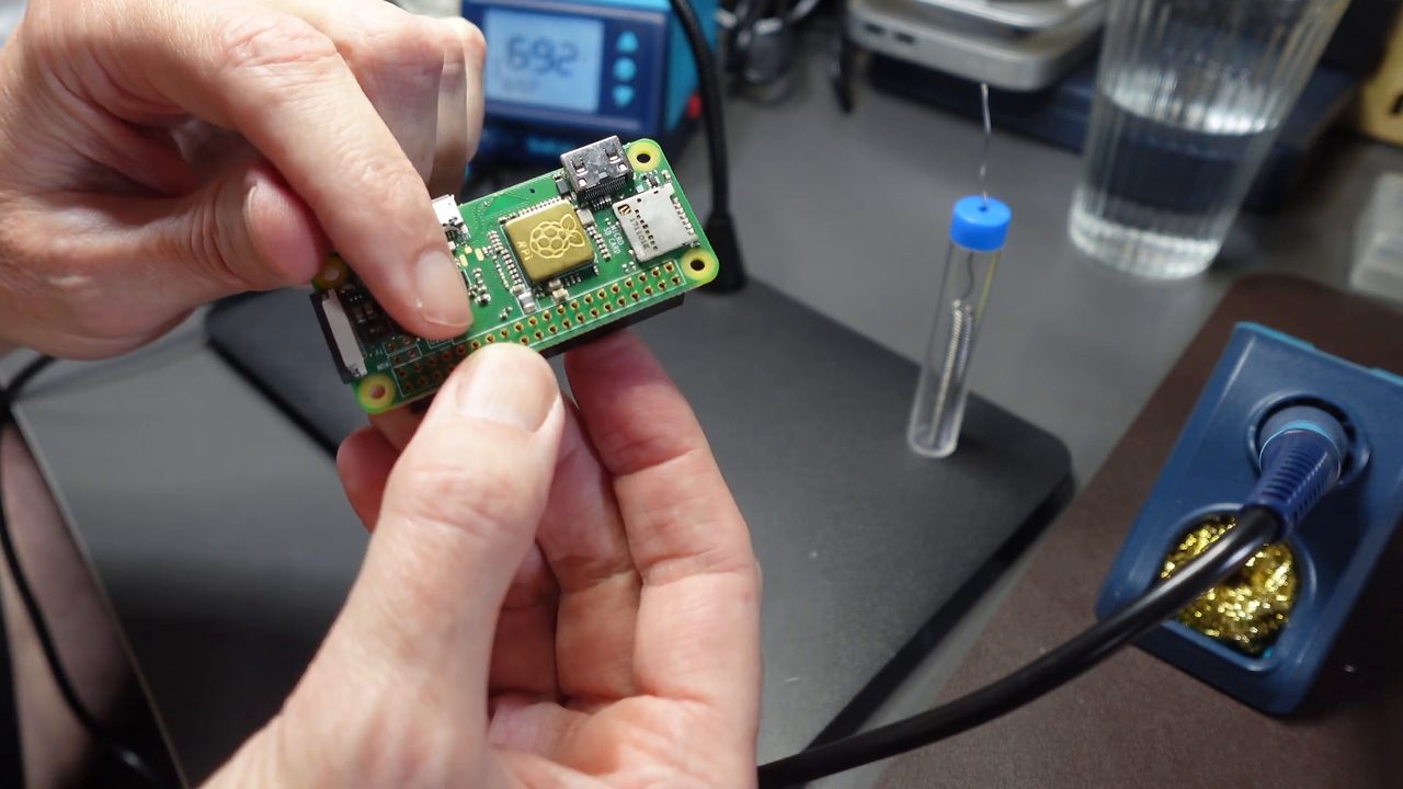 The Pi Zero with the female header soldered on, chips facing up and the header underneath