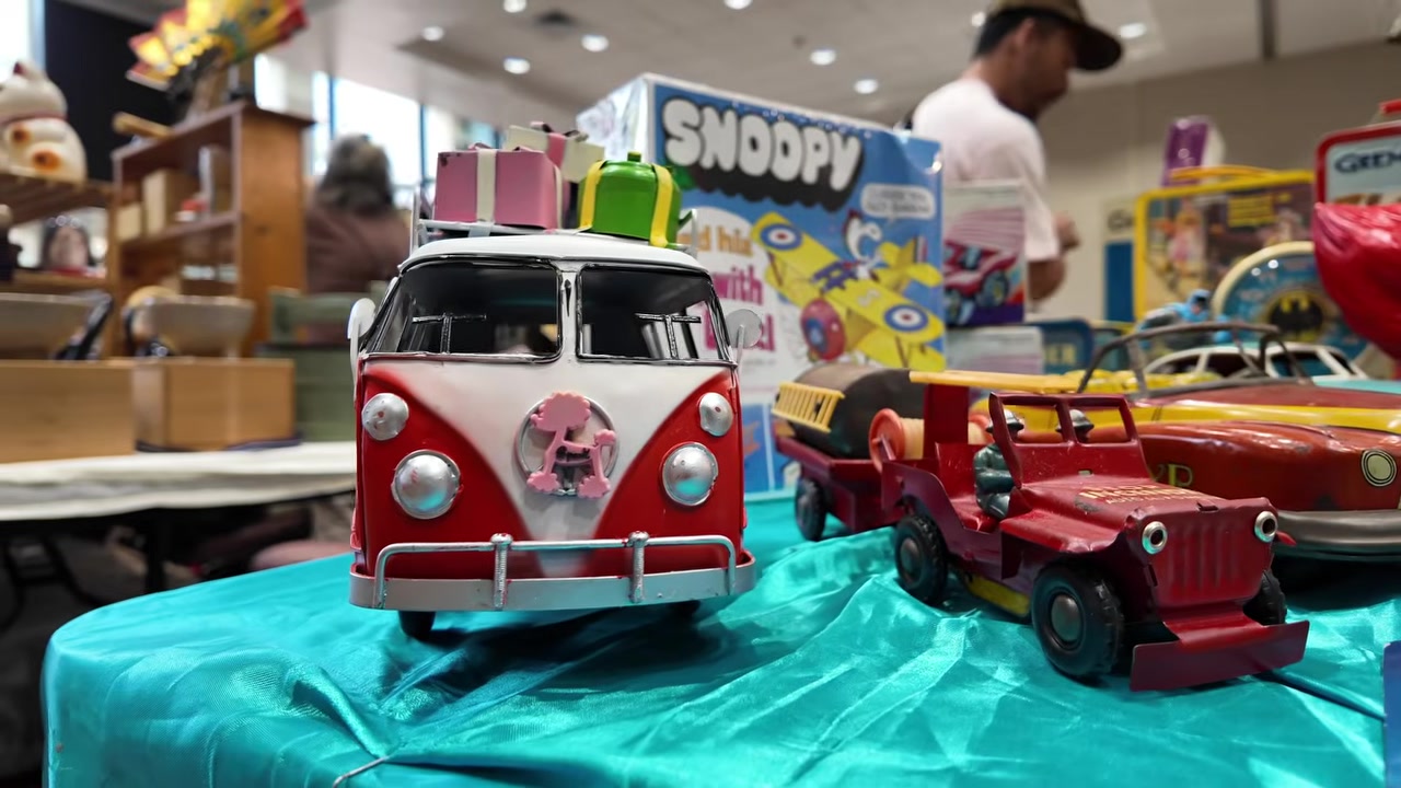 Vintage Volkswagen bus, Jeep, and Snoopy toys at the Honolulu vintage show