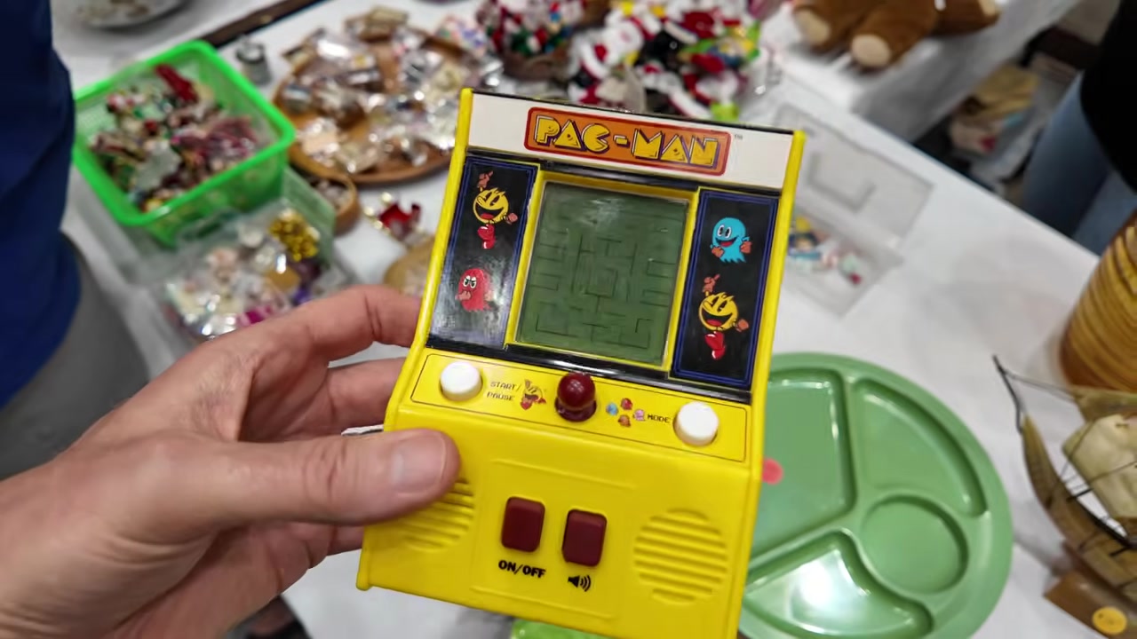 Yellow handheld LCD Pac-Man game at the Honolulu vintage show