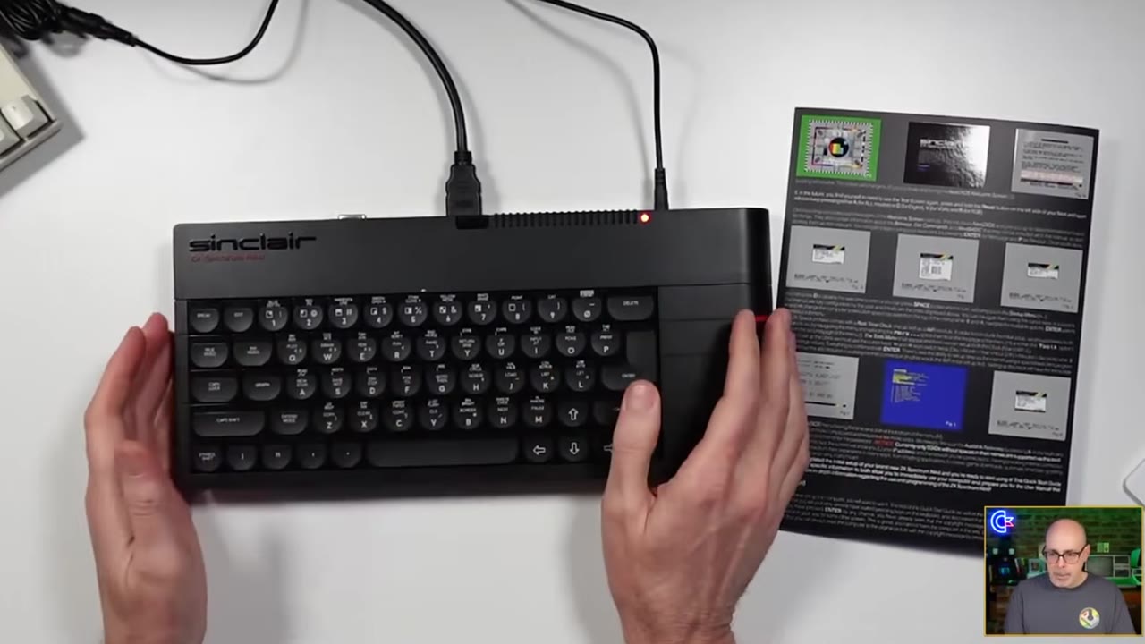 My hands on the Next's keyboard with the Quick Start card